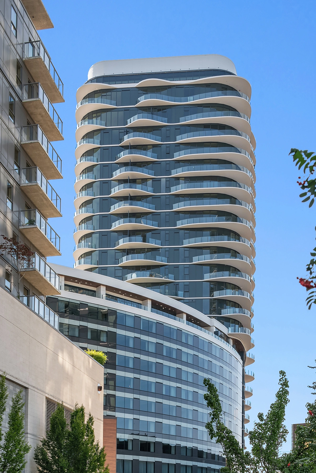 The Estates tower at Nobu Residences Bellevue with sculptural curved balconies in Downtown Bellevue